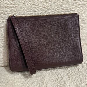 Cuyana leather clutch in plum color